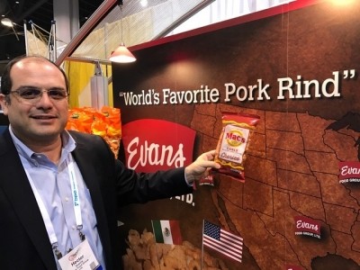 VP of sales at Evans Food, Hector Guerra, with the company's latest pork rind offering at Snaxpo.  