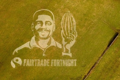 Fairtrade's giant grass painting of Bismark Kpabitey, a Fairtrade cocoa farmer, launches its fortnight of events to highlight sustainability issues. Pic: Sand In Your Eye