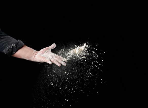 Baker throwing flour dust nndanko