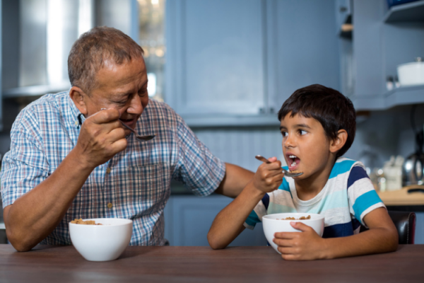 Getty Images - Indian grandfather and boy eating breakfast Wavebreakmedia