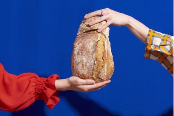Two hands with bread Getty