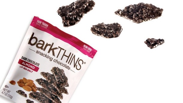 Natural products, such as barkTHINS, are leading the snack segment growth in specialty channel, Spins found.