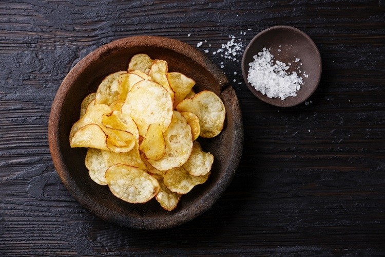 Salty snacks producers are facing the conundrum of reducing sodium but retaining flavour. Pic: GettyImages/Lisovskaya