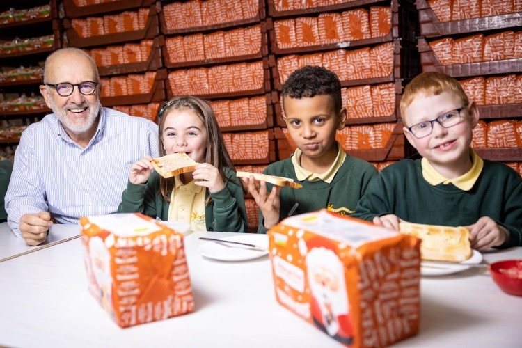 Jonathan Warburton celebrates the UK bakery manufacturer's one millionth donation with the children of Church Road Primary School in Bolton. Pic: Warburtons