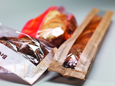 Paper bags for savoury snacks with clear windows on the packaging