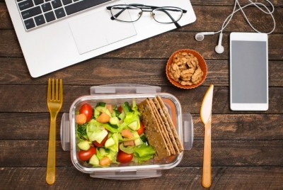 Americans admit to eating lunch at their desks two to three times a week. Pic: Getty Images/p_ponomareva