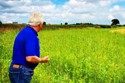 A PepsiCo oat farmer in his field surrounded by wildflower borders, part of his sustainability efforts / Pic: Quaker